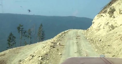 Peterbilt logging truck coming off cliff with load in Bellingham,Wa.